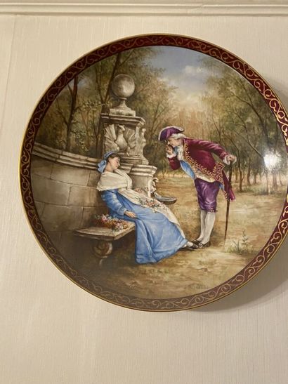 null Paire de plats en porcelaine à décor polychrome de scènes galantes, signée E.C....