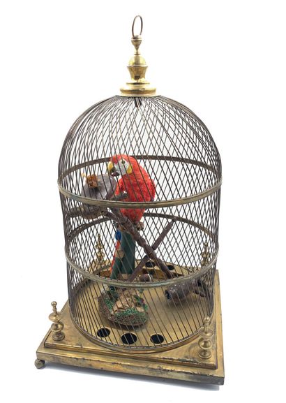 null Cage à oiseaux en laiton doré, ornée d'un perroquet, et son portant en bois...