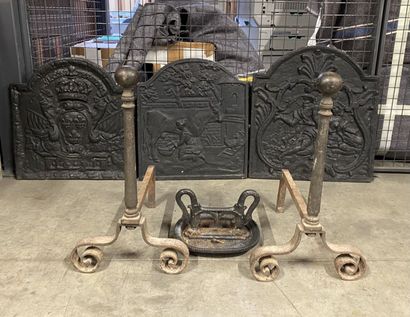 null Set including three firebacks, a boot scraper and a pair of cast iron lande...