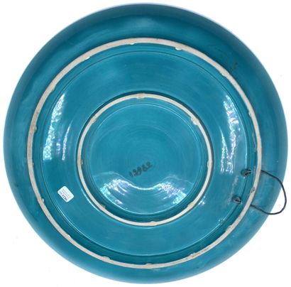 null T. BENAIS (XXth century)
Circular enamelled ceramic dish with polychrome decoration...