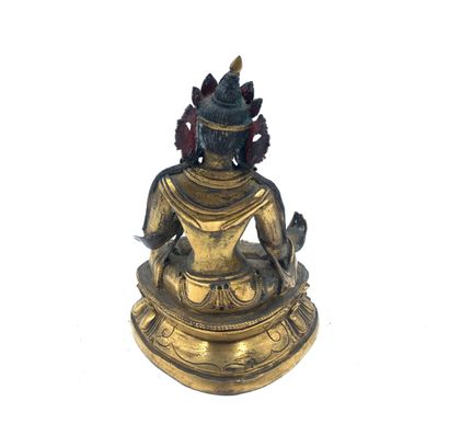 null Sino-tibétain, XIXe siècle 
Sujet en bronze doré figurant Bouddha assis en padmasana....