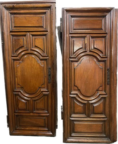 null Natural wood cabinet, opening to two doors with molded decoration of panels,...