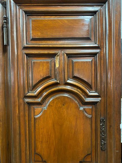 null Natural wood cabinet, opening to two doors with molded decoration of panels,...