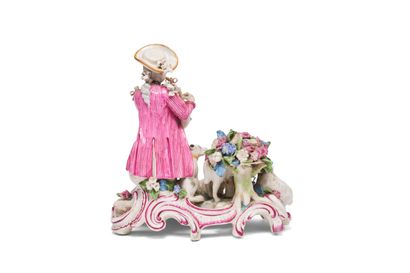 null GERMANY
Porcelain group representing a young shepherd playing the bagpipes
on...