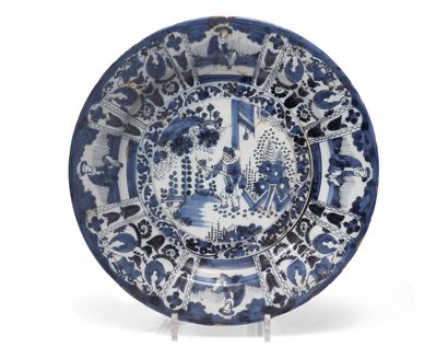 null DELFT
Small round dish decorated in blue monochrome with Chinese in a lake landscape...