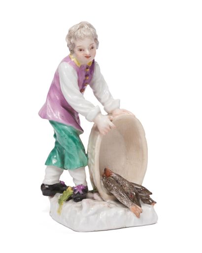 null MEISSEN
Porcelain statuette representing a young child
fishmonger standing on...