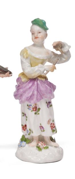 null MEISSEN
Porcelain statuette representing a young girl standing
playing an instrument,...