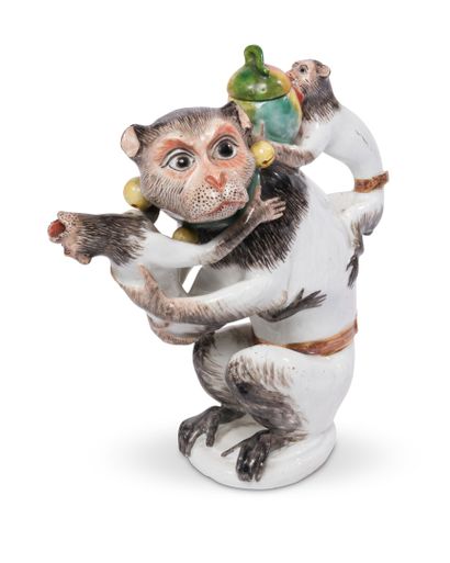 null MEISSEN
Porcelain teapot in the shape of a seated monkey holding a small one...