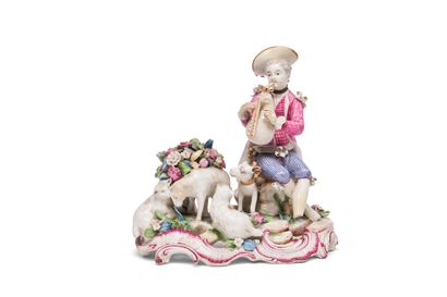 null GERMANY
Porcelain group representing a young shepherd playing the bagpipes
on...