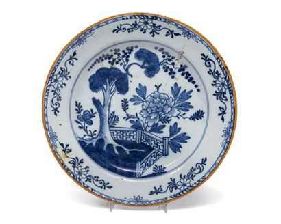 null Delft
Three round earthenware dishes decorated in blue monochrome on one of...