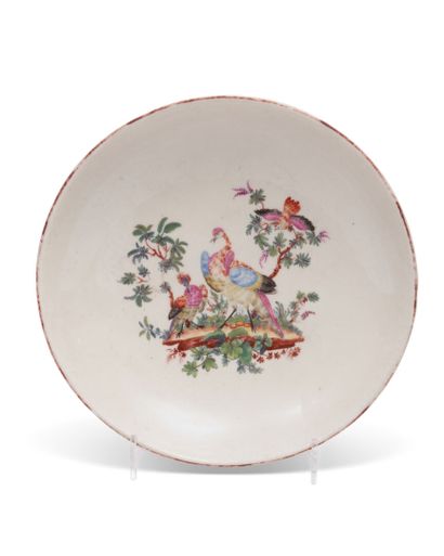 TOURNAI
Large saucer in soft porcelain decorated...