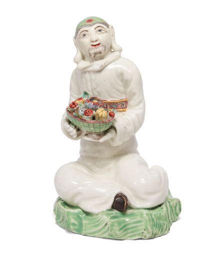 null SAINT-CLOUD
Figure of Chinese in soft porcelain, seated on a terrace with green...