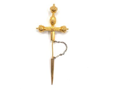 null Brooch in yellow gold (E.T. mark) representing a sword, the handle decorated...