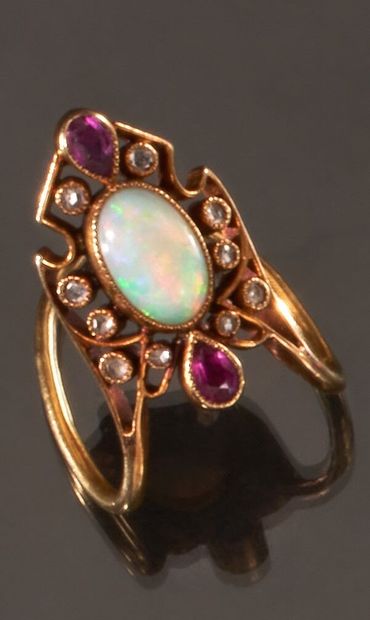 null Yellow gold ring 750 thousandths decorated in the center of an oval opal between...