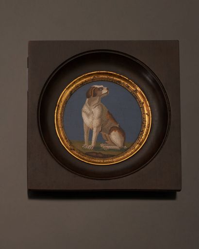 null Micromosaic of round form representing a dog sitting on a blue background. In...