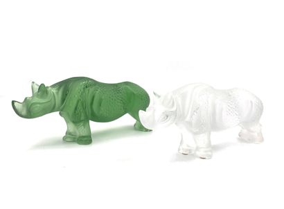 null LALIQUE
Rhinocéros en cristal 
Deux épreuves en cristal blanc et vert. 
H. 12...