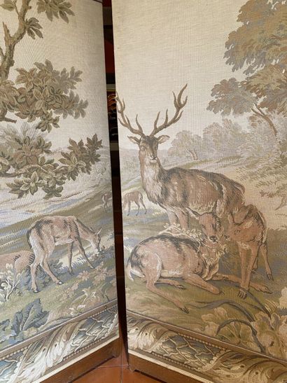 null TWO three-leaf wooden folding screens upholstered in Aubusson-style petit point...