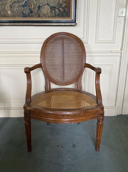 null Medallion-back armchair, seat and back caned, fluted uprights in molded and...