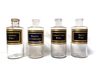 null FOUR glass PHARMACY JARS, inscribed on gold and black labels: Cubèbes Pulv;...