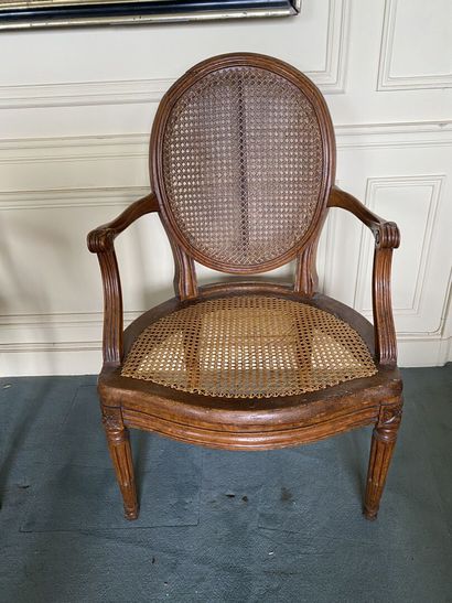null Medallion-back armchair, seat and back caned, fluted uprights in molded and...