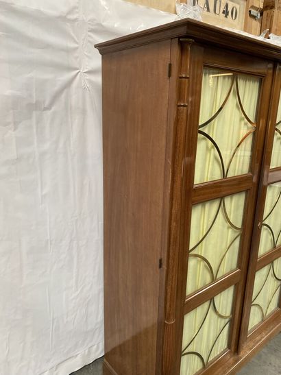 null Mahogany and mahogany veneer LIBRARY opening to two glass doors decorated with...
