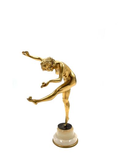 null Claire COLINET (1880-1950) 
The Juggler
Gilded bronze proof, on a beige onyx...