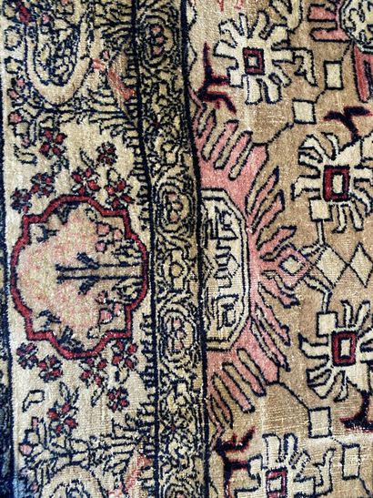 null KIRMAN, 19th century 
Silk carpet decorated with a vase inscribed in a central...