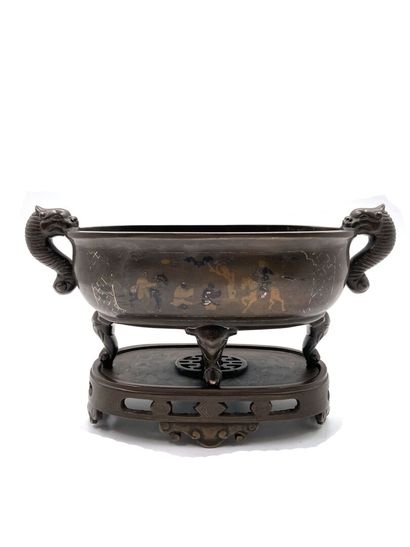 null INDOCHINA, circa 1900
Bronze perfume burner with four elephant-head feet and...