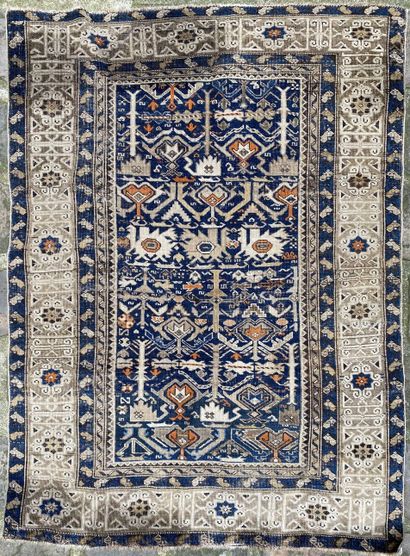 null CHIRVAN, 19th century 
Carpet decorated with repetitive motifs on a blue background.
160...