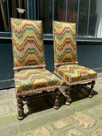 null TWO CHAIRS with high backs, fully upholstered seat and back, turned wooden legs...