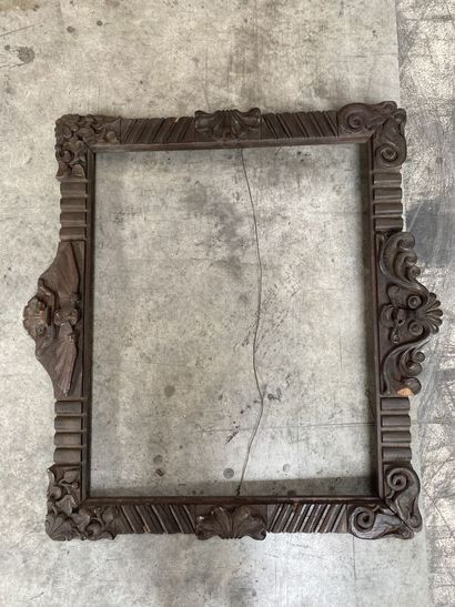 null TWO rectangular frames in natural wood carved with fluting, shells and interlacing....