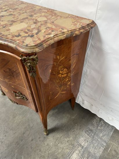 null A marquetry COMMODE opening to two drawers decorated with a floral basket, standing...