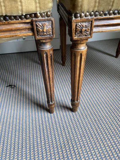 null TWO CHAIRS in molded and carved natural wood, straight back, fluted tapered...