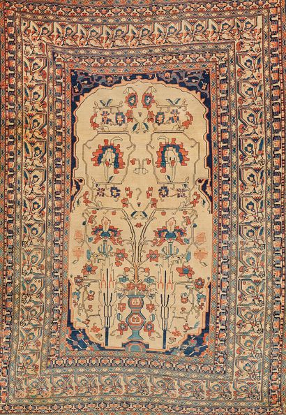 null SARROUCK, 19th century 
Carpet decorated with a flowering vase on an ivory background,...