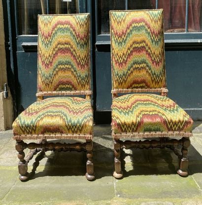 null TWO CHAIRS with high backs, fully upholstered seat and back, turned wooden legs...