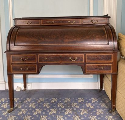 null Cylinder desk in mahogany and mahogany veneer, opening to a rand of three tiered...