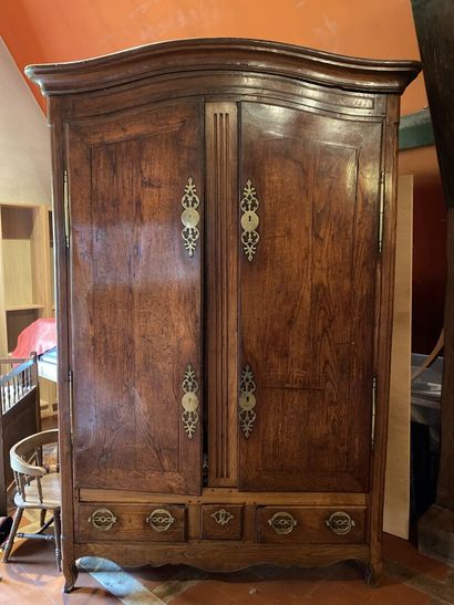null LARGE MOLDED AND CARVED OAK ARMOIRE, opening with two doors and three drawers...