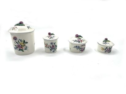 null In the style of Mennecy
Four porcelain ointment jars with polychrome decoration...