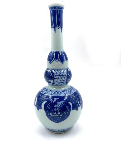 null China
Porcelain baluster vase decorated in blue underglaze with floral braids...