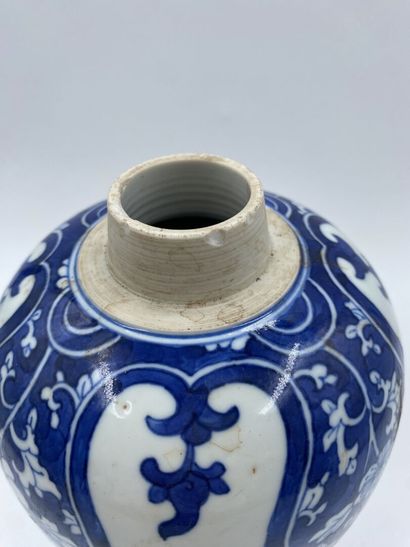 null CHINA 
White-blue vase with flowers 
Height: 24 cm
