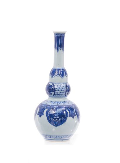 null China
Porcelain baluster vase decorated in blue underglaze with floral braids...