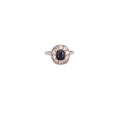 null 850 thousandth platinum ring set with a cushion sapphire in a setting of ten...