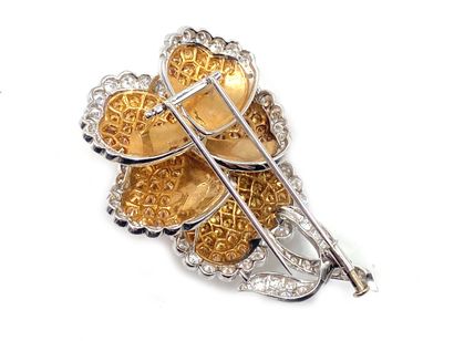 null 750 thousandth white gold lapel clip featuring a flower entirely set with round...