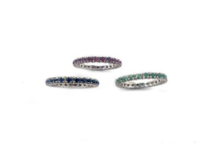 null Three wedding bands in 750 thousandths white gold, each set with a line of rubies,...