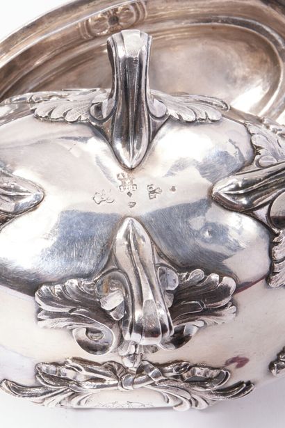 null Oval quadripod sugar pot, in silver decorated with foliate cartouches and monogrammed...