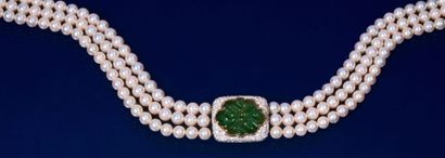 null Three-row necklace of choker cultured pearls holding a central motif adorned...
