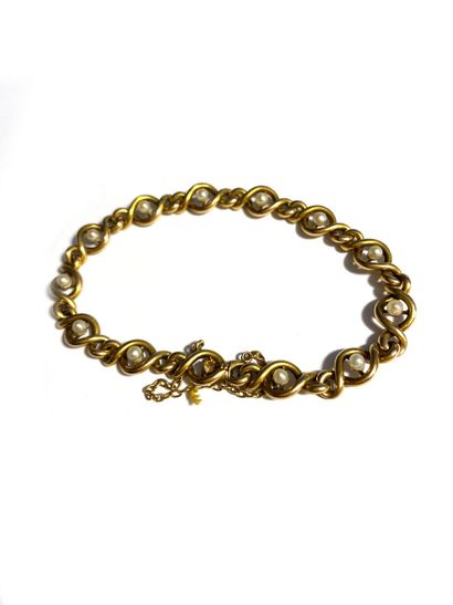 null Bracelet articulé en or jaune 750 millièmes, les maillons ornés de petites perles...