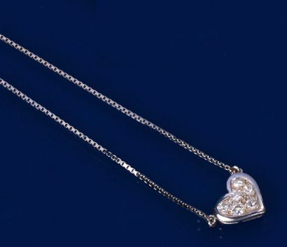null Articulated white gold necklace adorned in the center with a heart motif paved...