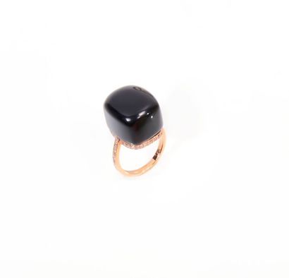 null PALWER
Ring in 750 thousandths pink gold set with an onyx cabochon, encircled...