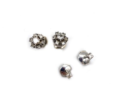 null Two pairs of earrings in 750 thousandths white gold, each set with brilliant-cut...